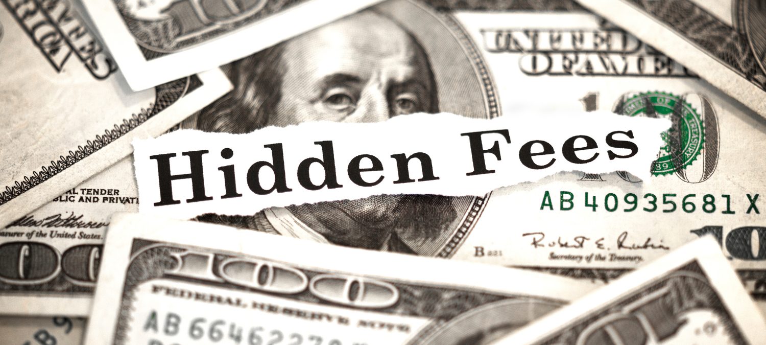 Image of U.S. dollar bills overlaid with a paper strip saying "Hidden Fees," symbolizing the unforeseen additional costs in homebuying like closing costs, property taxes, and maintenance, which are not included in the home's sale price.